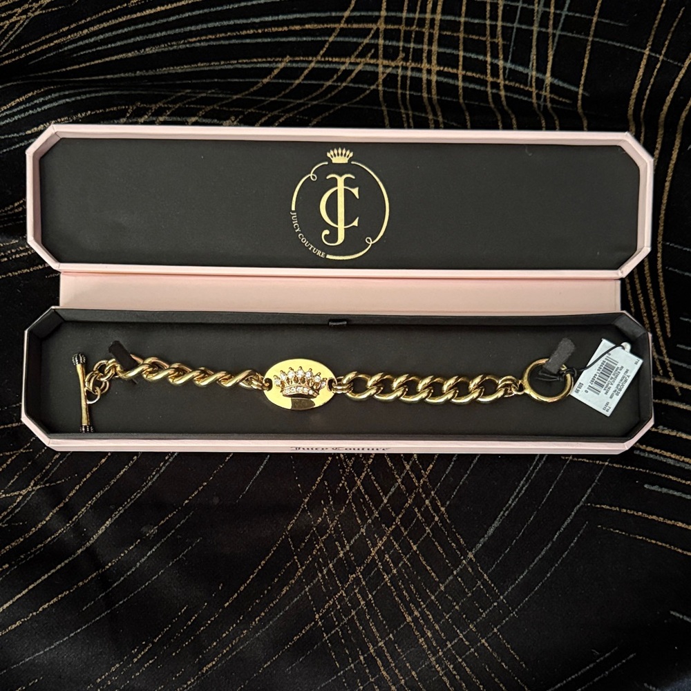 Juicy Couture Shield Crown and Heart Chain Bracelet. Crown has stones on it.